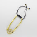 Pulsera Tejida de Esferas Doradas con Dije Circular de Cruz