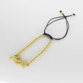 Pulsera Tejida de Esferas Doradas con Dije de Serpiente