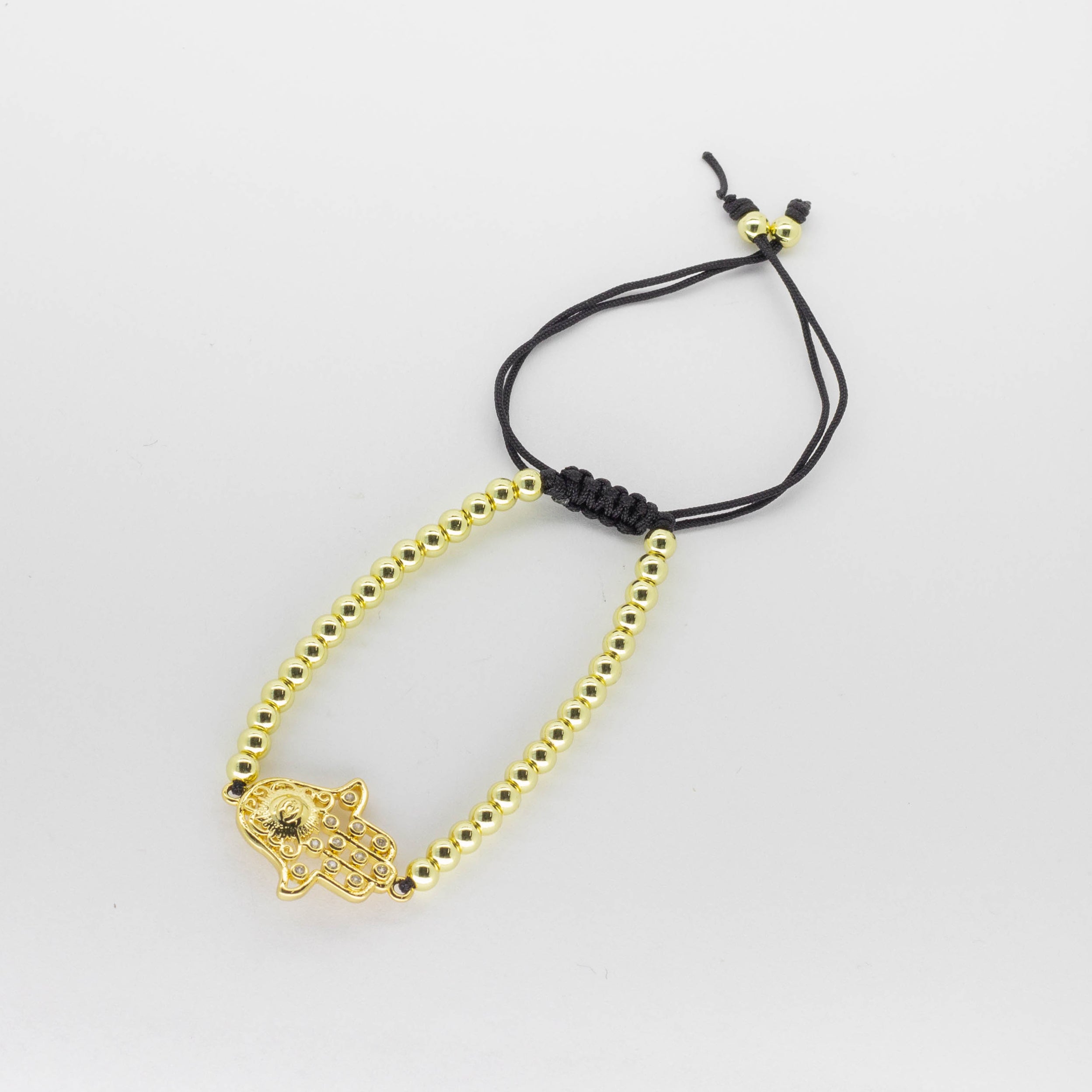 Pulsera Tejida de Esferas Doradas con Dije Mano de F tima