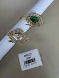 Anillo dorado diseño hoja con piedra central