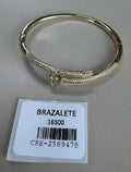 Brazalete Dorado Forma Clavo con Pedrería Transparente